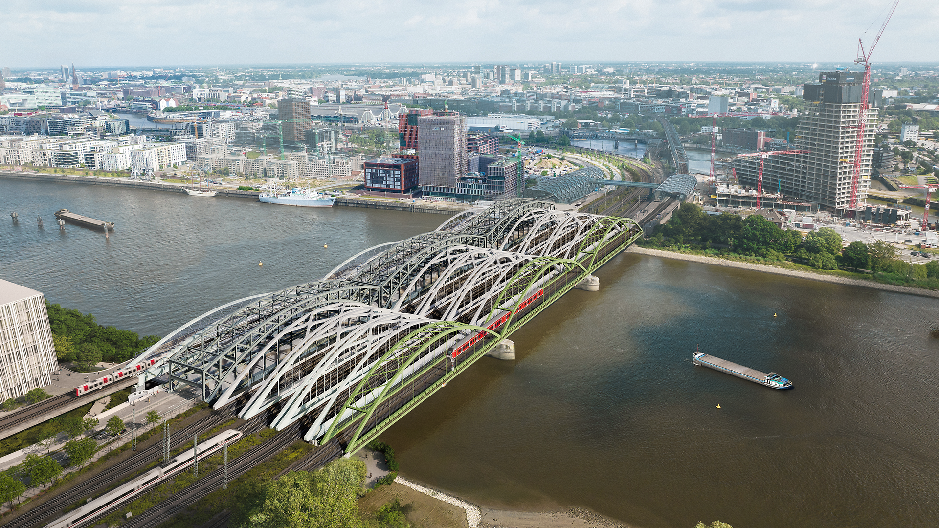 Der Blick auf die neuen Eisenbahnbrücken (2. bis 4. v.r.) über die Norderelbe